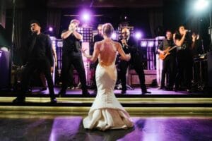 Austin Texas Live Wedding Band shown with bride dancing at the stage