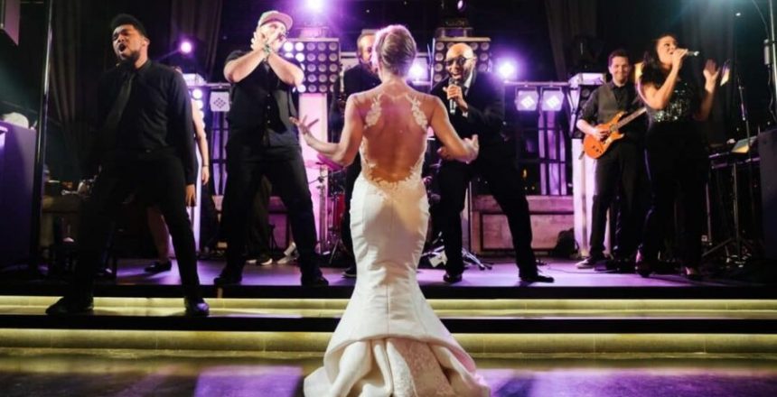 Austin Texas Live Wedding Band shown with bride dancing at the stage